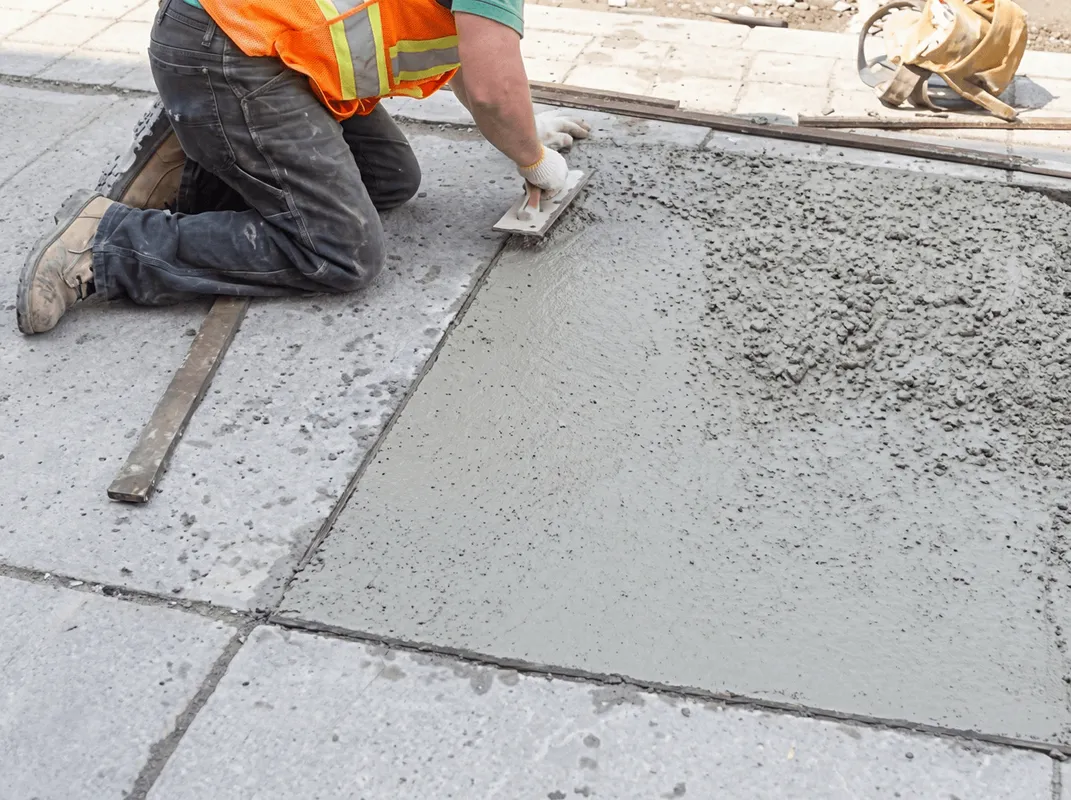 Professional repairing a concrete floor in Nashville, TN